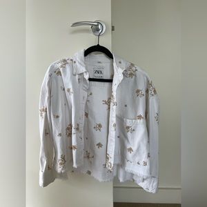 White embroidered jean jacket size S.